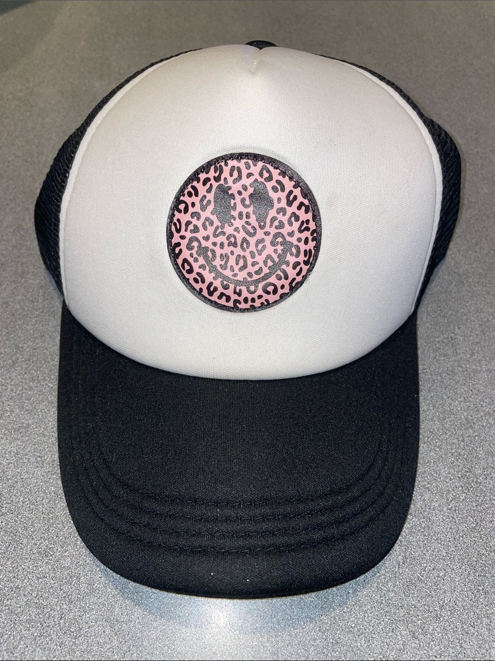 Black & White Trucker Cap with Pink Leopard Smiley Patch